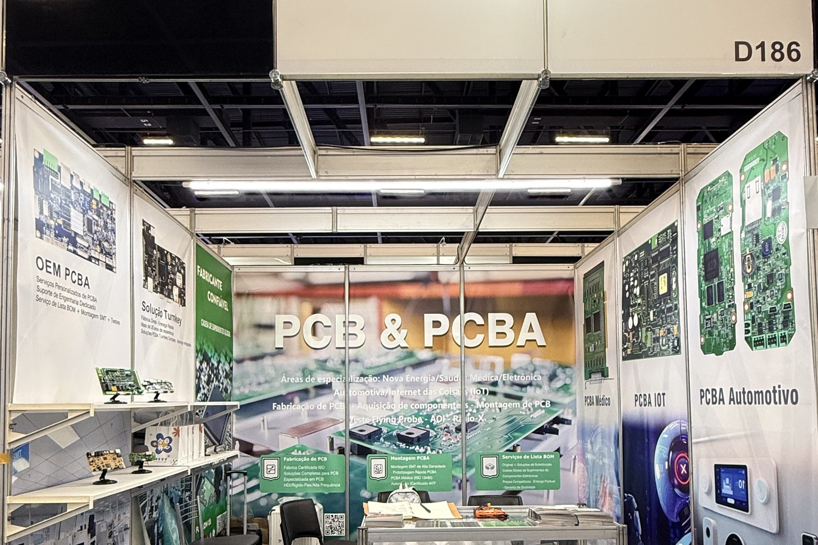 A Hongrong (Shenzhen) Electronics exhibition booth at an industry trade show: fascia board, product posters and a glass display case, photographed before the doors opened