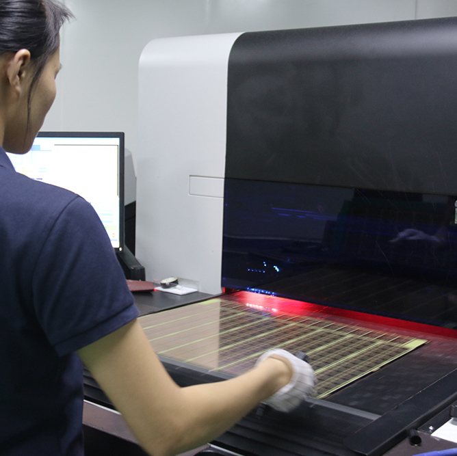 Operator running electrical test on a finished PCB at Hongrong