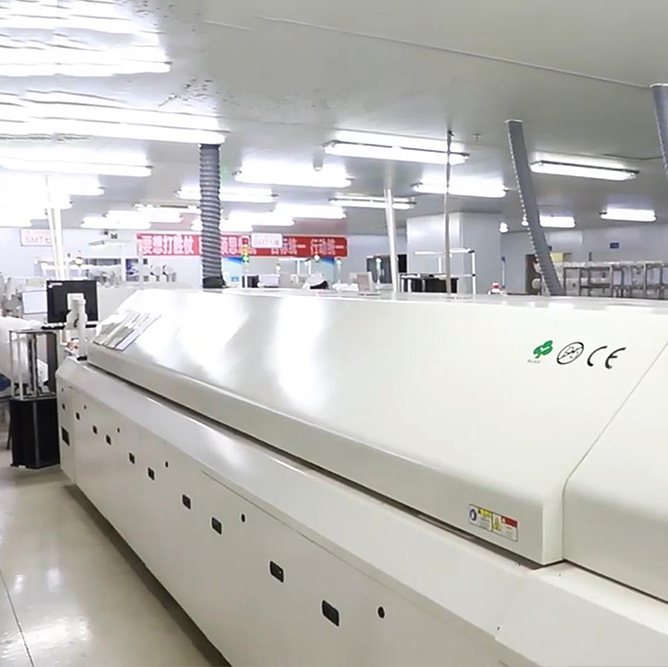 Multi-zone reflow oven on the SMT line at Hongrong