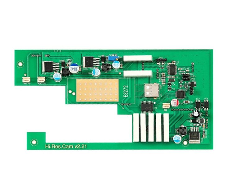 An L-shaped green PCB with a rectangular gold contact area, a row of white fingers along the bottom and black connectors on the right edge